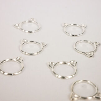 Silver stitch markers with cat ears.